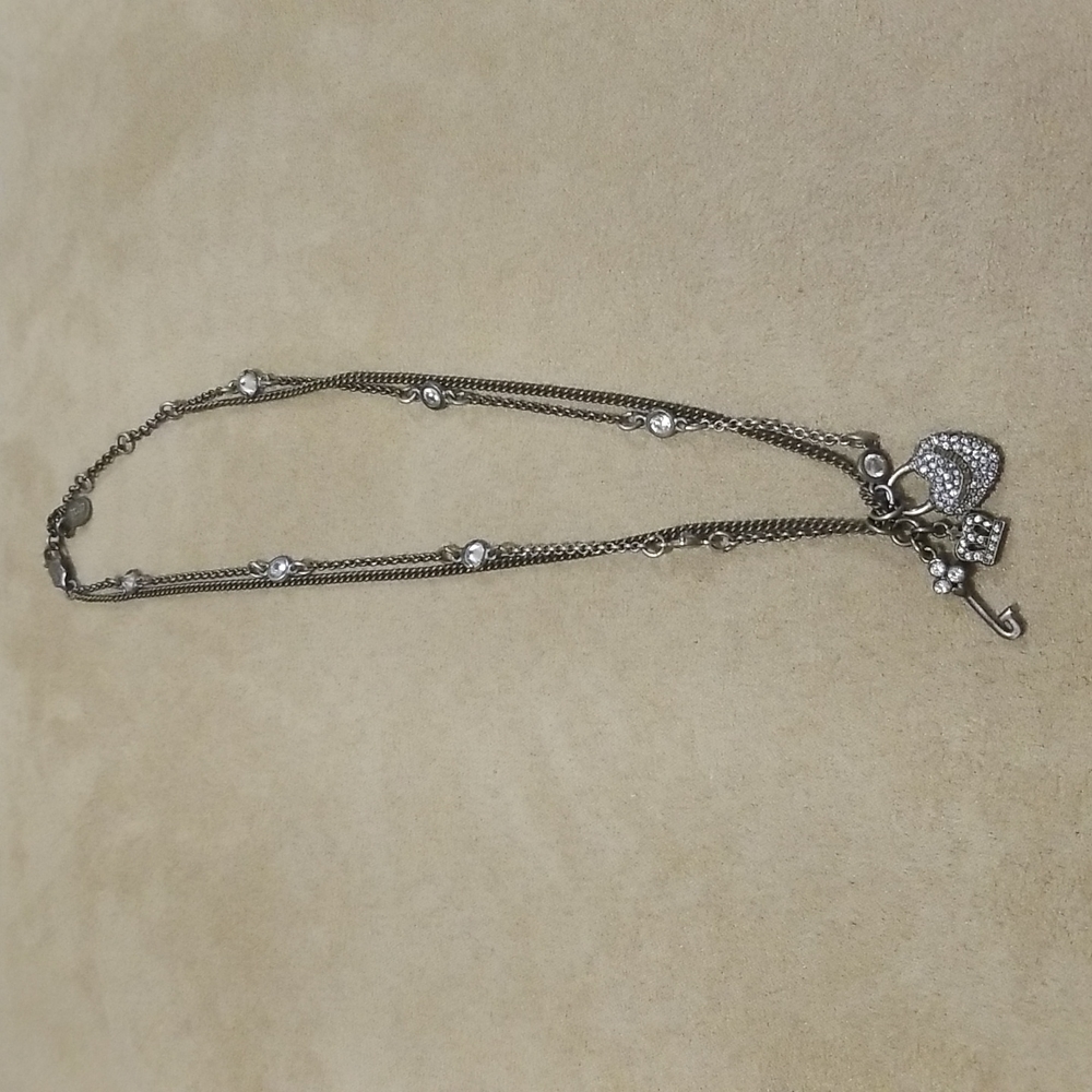 Juicy Couture onyxed silver plated charm double strand necklace. Worn once.